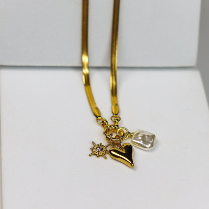 Sparkling Heart Charm NecklaceProduct Details: Metal - Stainless Steel Anti-Tarnish 18k Gold Plated Waterproof Everyday Wear *Our stainless steel pieces, featuring anti-tarnish and hypoallergenic attributes, are perfect for sensitive skin.